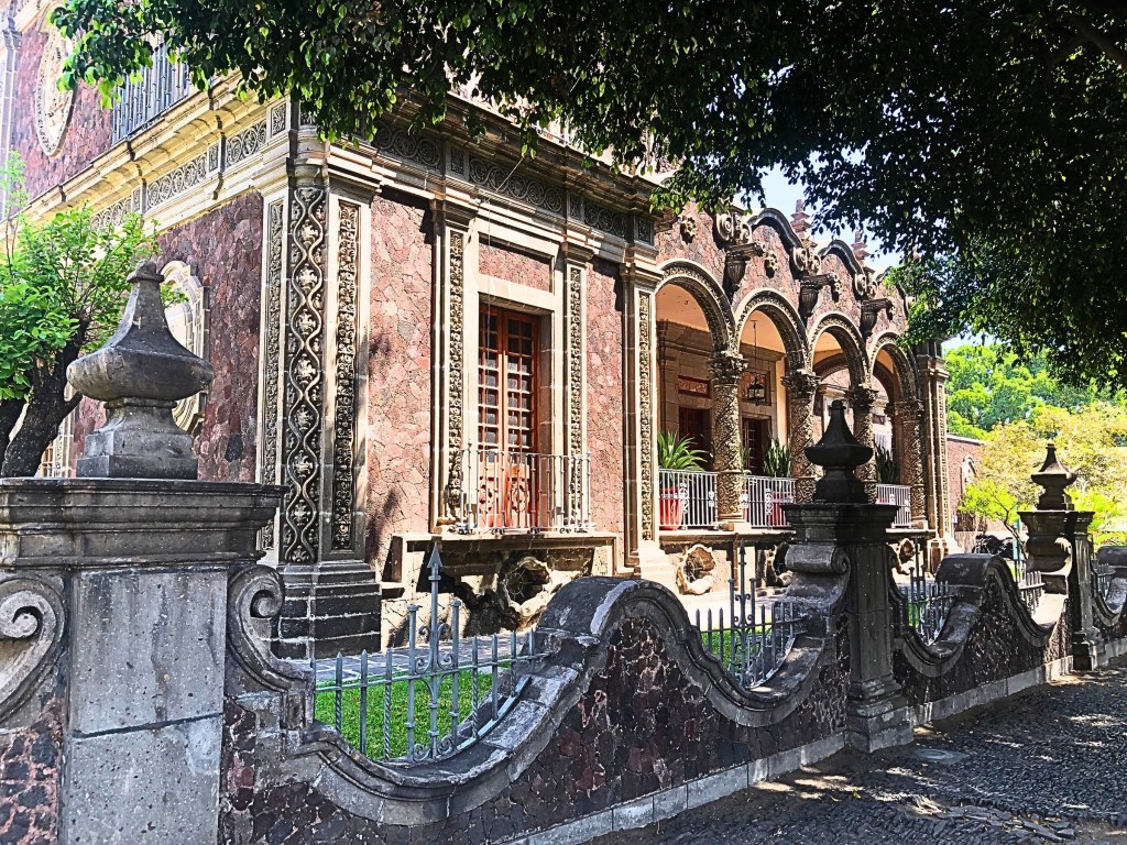 Front view of Casa Zuno, showcasing its tezontle stone façade.