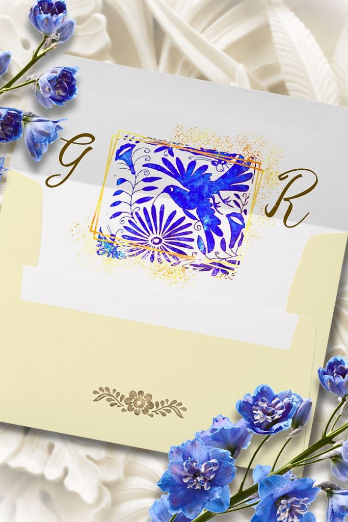 Elegant blush and gold envelope featuring ornate Baroque scroll motif and golden monogram, styled with pastel roses and pearl accents.