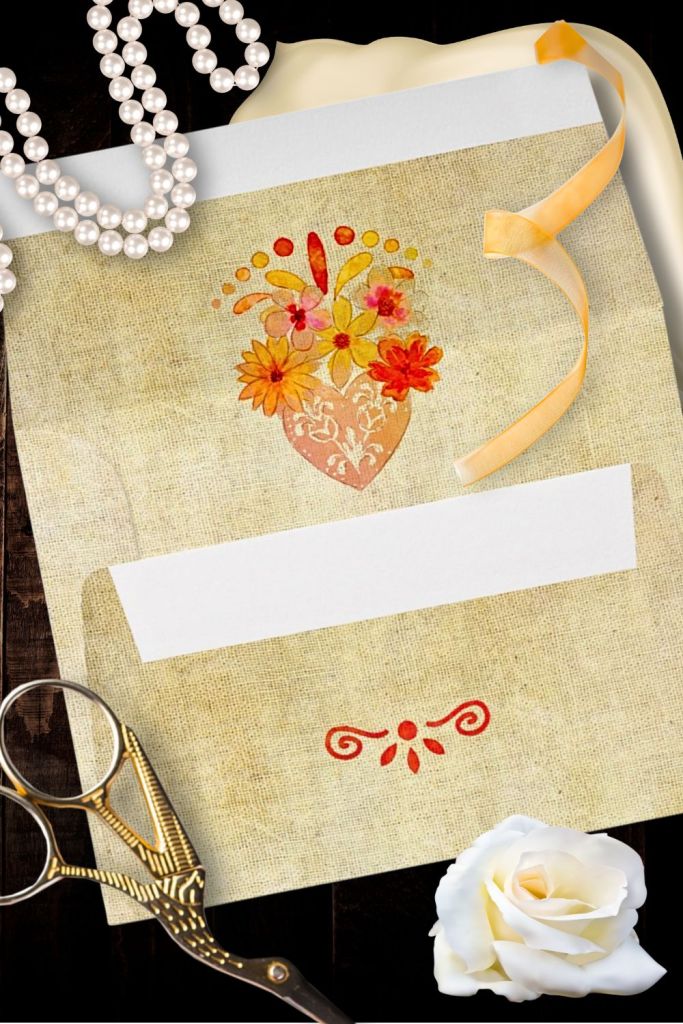 Baroque-inspired wedding envelope liner with hand-painted sacred heart bouquet in marigold, coral, and pink watercolor tones, set against an aged linen texture and styled with pearls and ribbon.